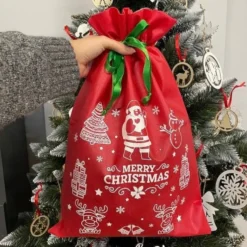 Julklappspåsar med snöre tomtemönster 45x29,5 cm 4-pack
