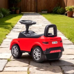 Officiellt licensierad Land Rover åkbil för barn 18-36 månader med förvaring, tuta och motorljud - Röd